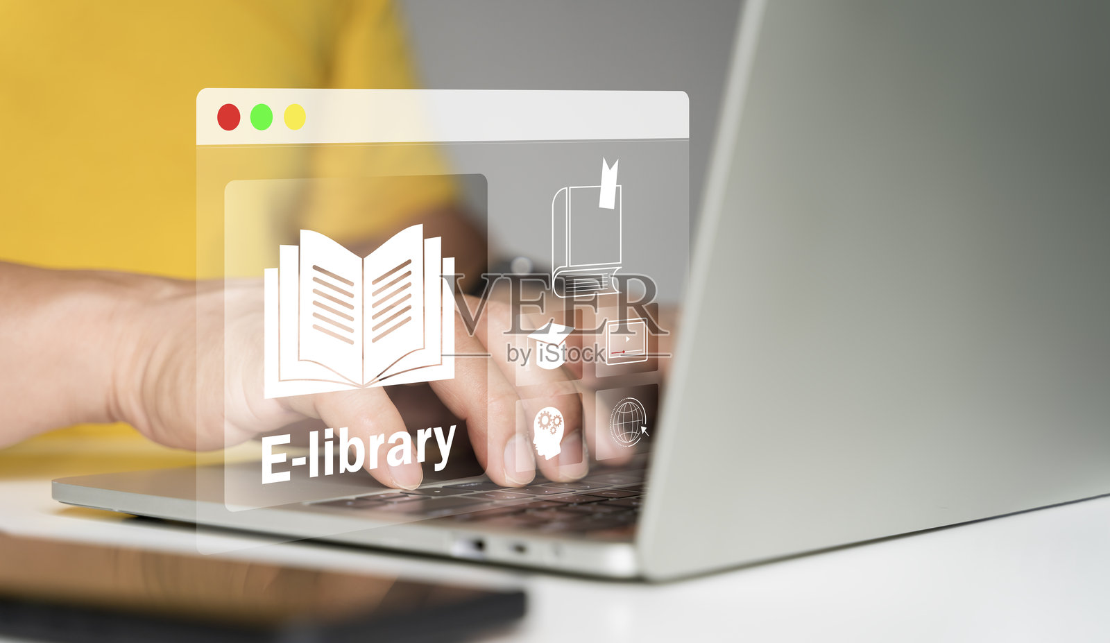 在线图书馆概念。人们使用带有虚拟电子书图标的笔记本电脑在线阅读照片摄影图片