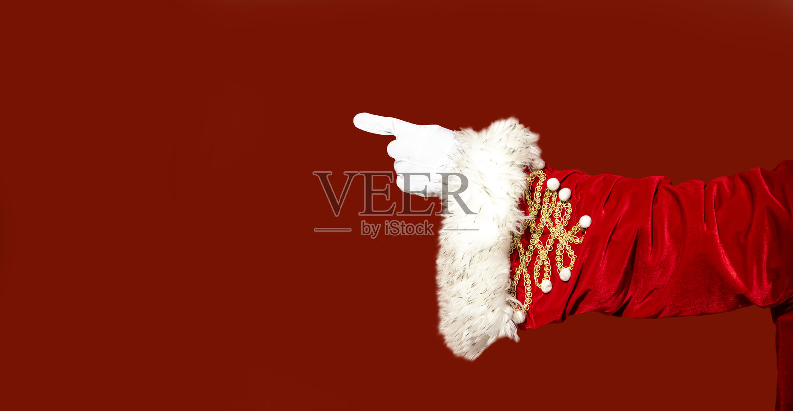 圣诞老人手指指向空白红色背景照片摄影图片