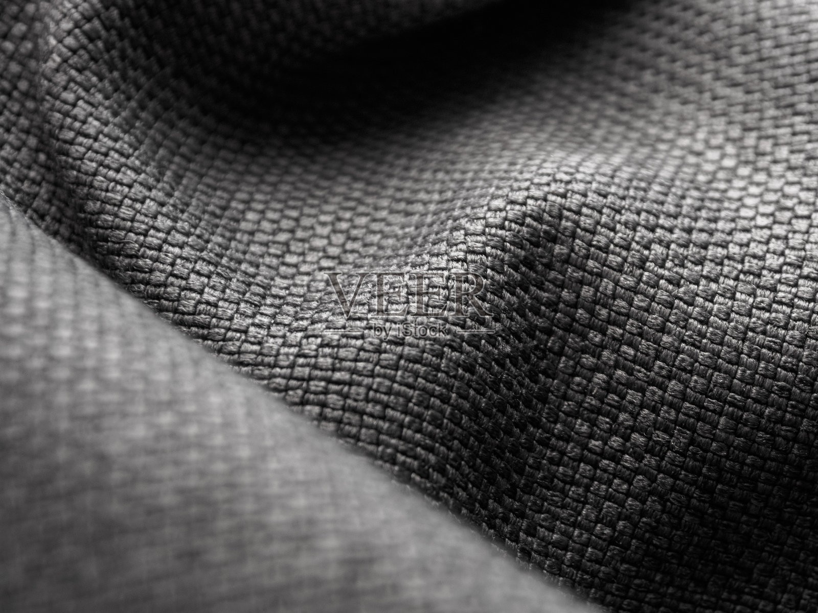 深色织物的微距摄影,突显其纹理和色彩深度,营造出优雅与舒适的氛围。照片摄影图片