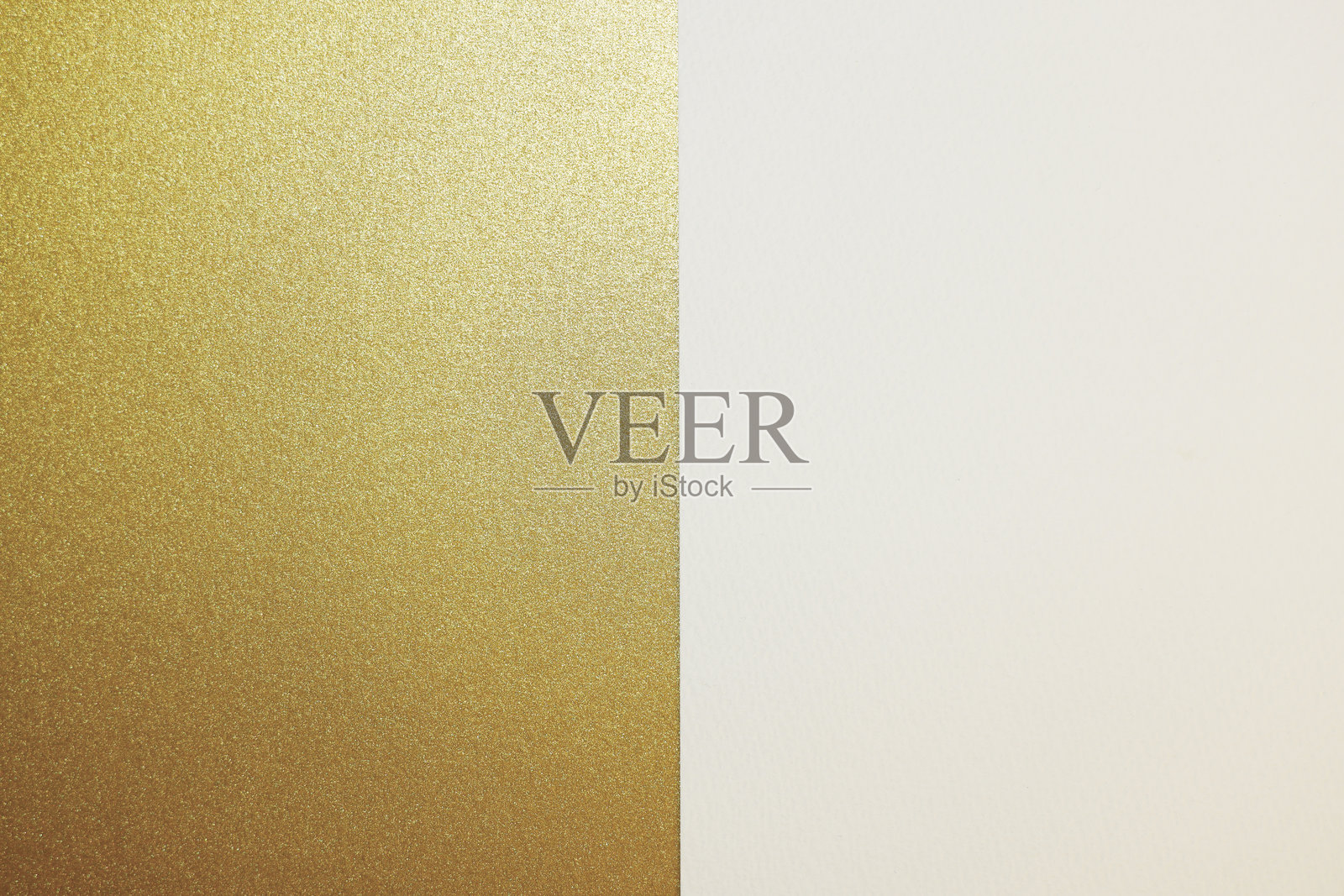 金色和白色的纸张背景或纹理。照片摄影图片