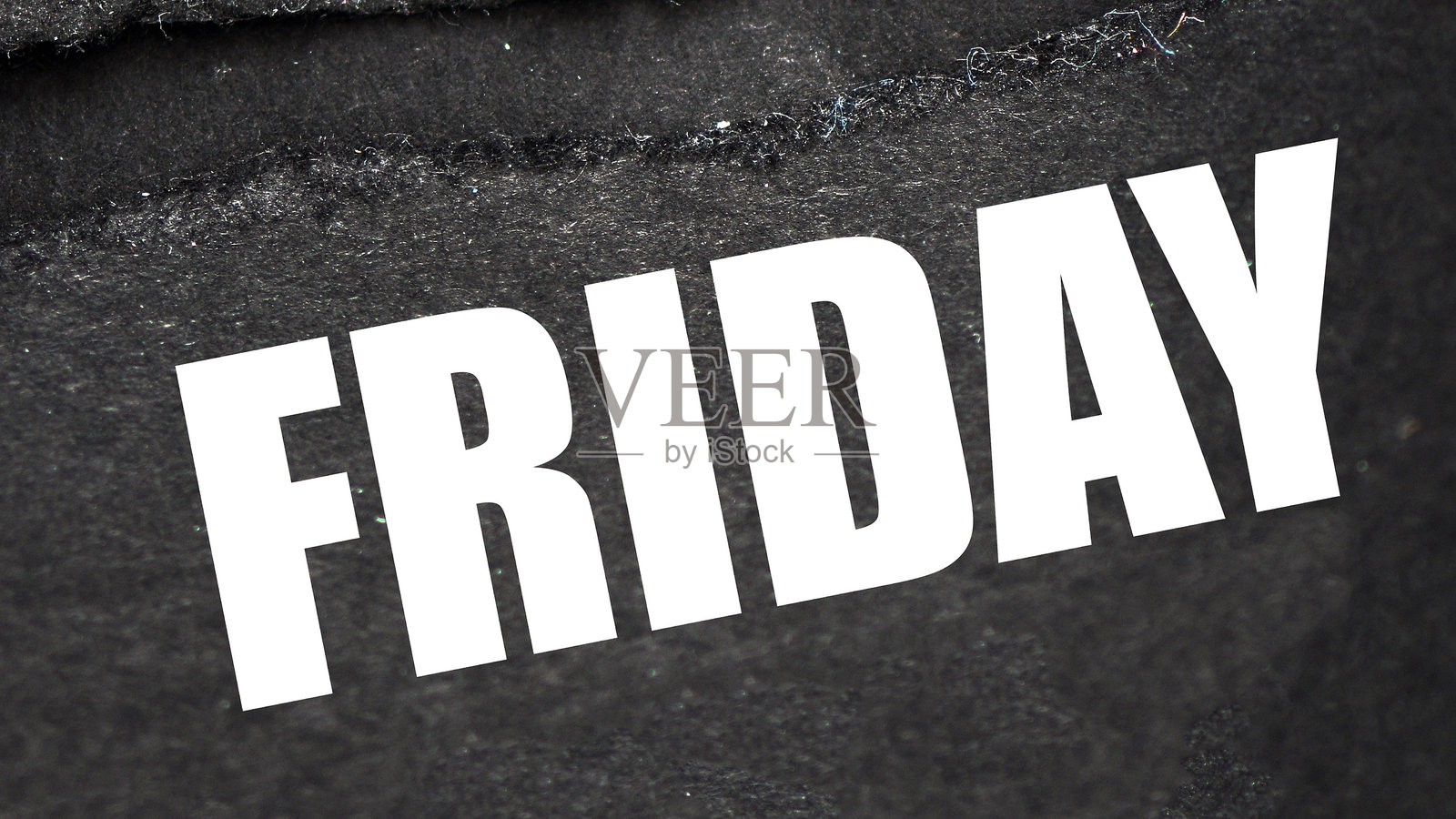 纸上写着“星期五”这个词。商店促销和打折的时间到了。照片摄影图片