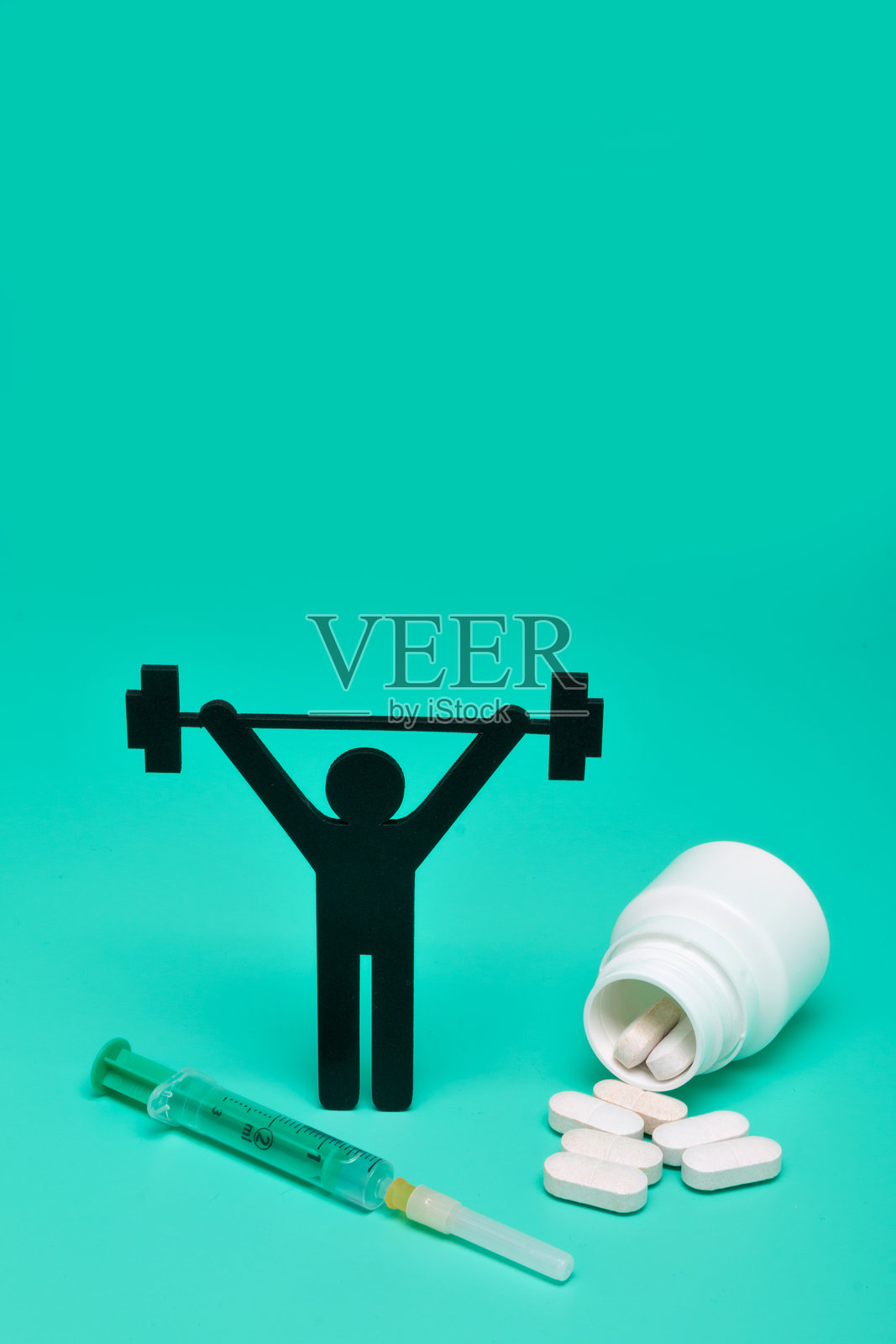 药物和卷尺的特写,背景为青绿色照片摄影图片