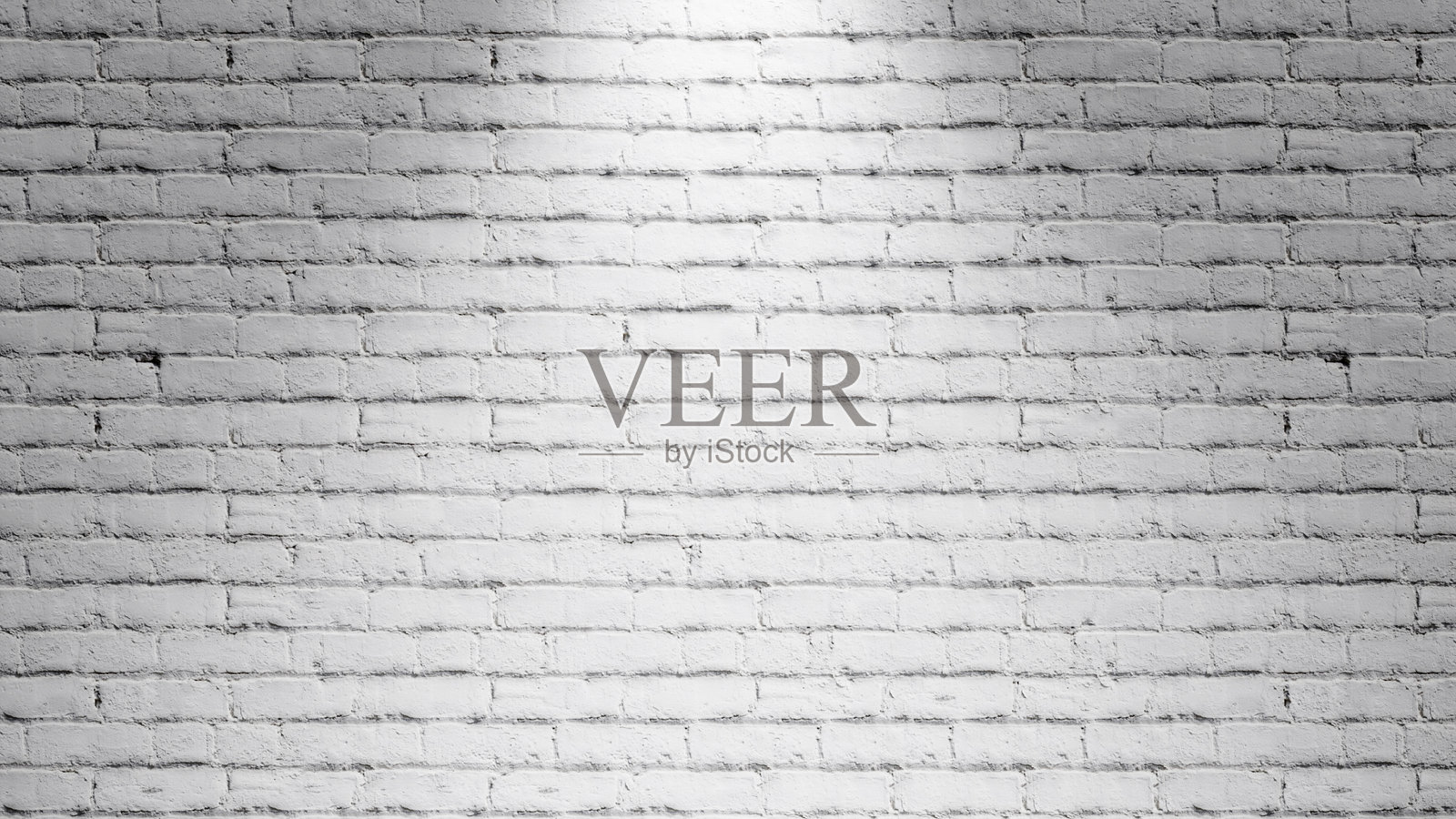 白色空砖墙,明亮的聚光灯,留有空白空间供文本和设计使用。明亮的聚光灯墙背景照片摄影图片