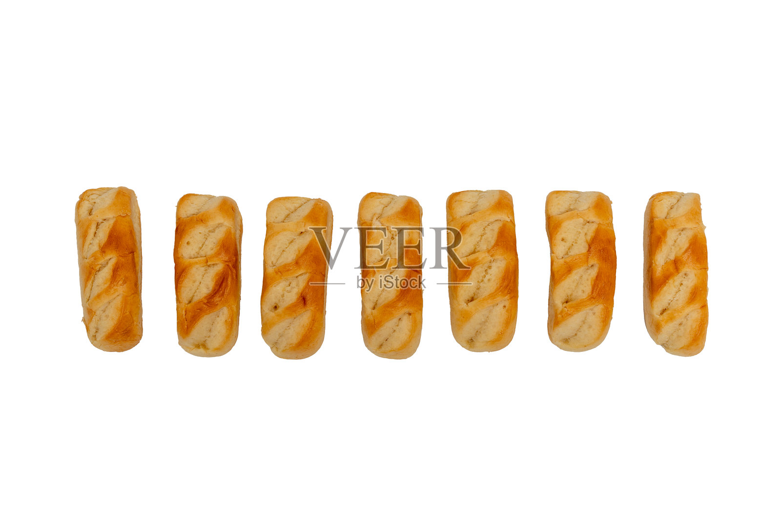 一排糖霜奶油包放在白色背景上。照片摄影图片