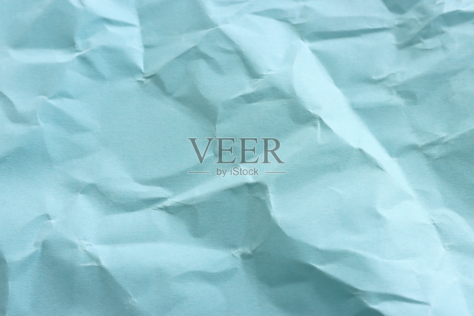 皱褶的蓝色纸张背景照片摄影图片