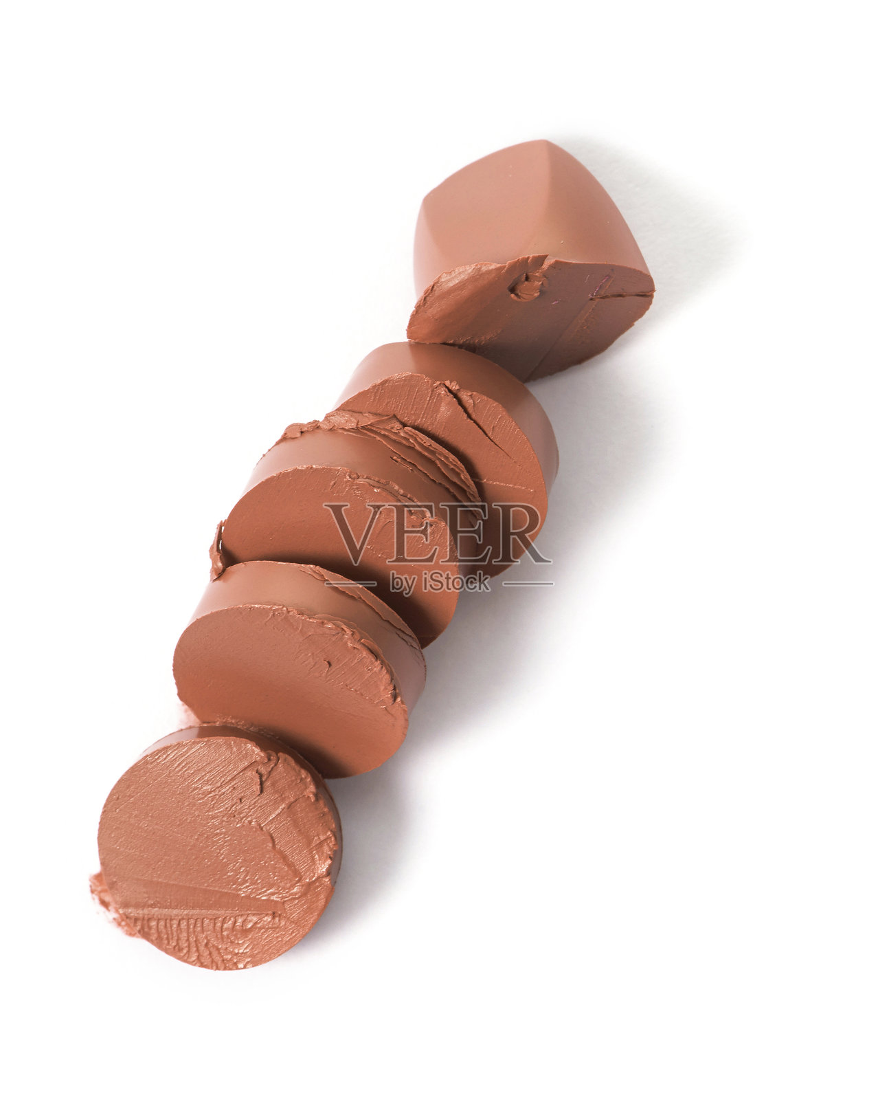 棕色口红在背景上切割的效果照片摄影图片