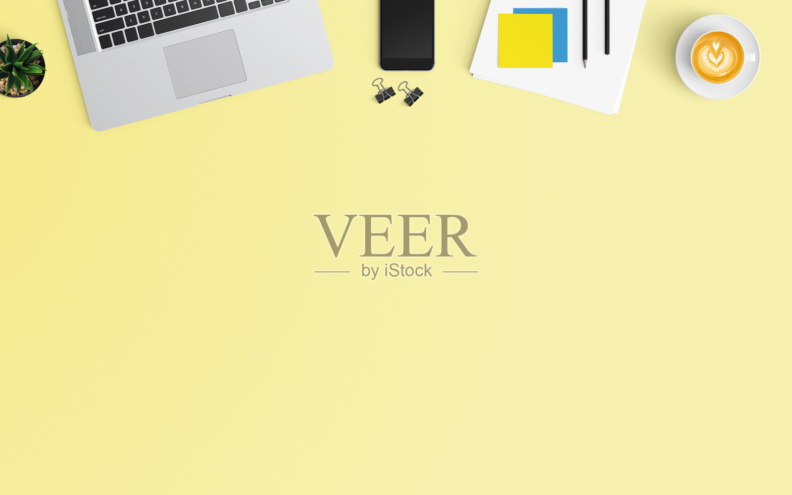 高角度视图的办公用品与咖啡在黄色背景上照片摄影图片