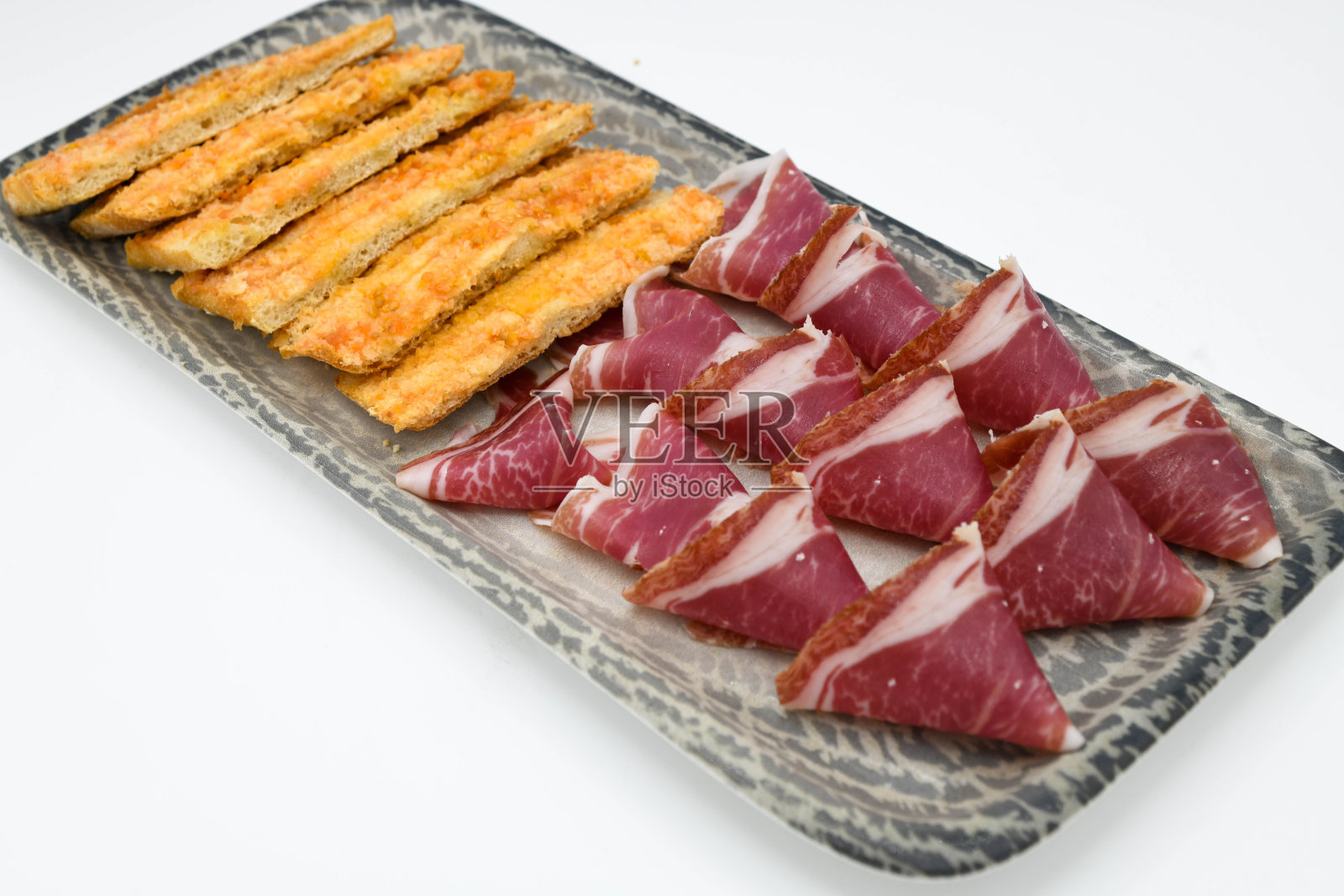 一块优质的伊比利亚风干火腿照片摄影图片