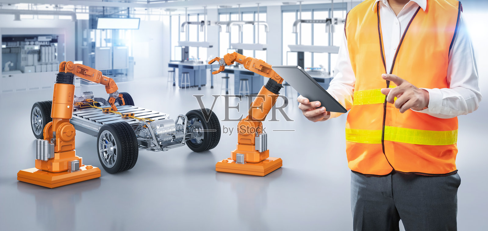 亚洲工程师或技术人员与电动汽车在工厂内照片摄影图片