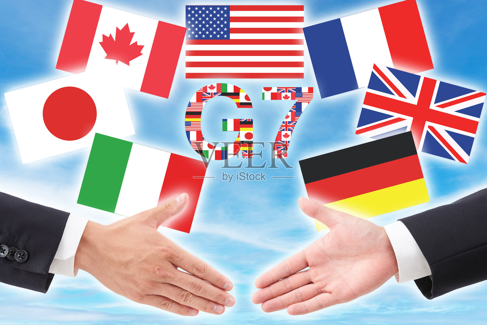 G7峰会合作概念,背景为蓝天,旗帜和握手图案照片摄影图片