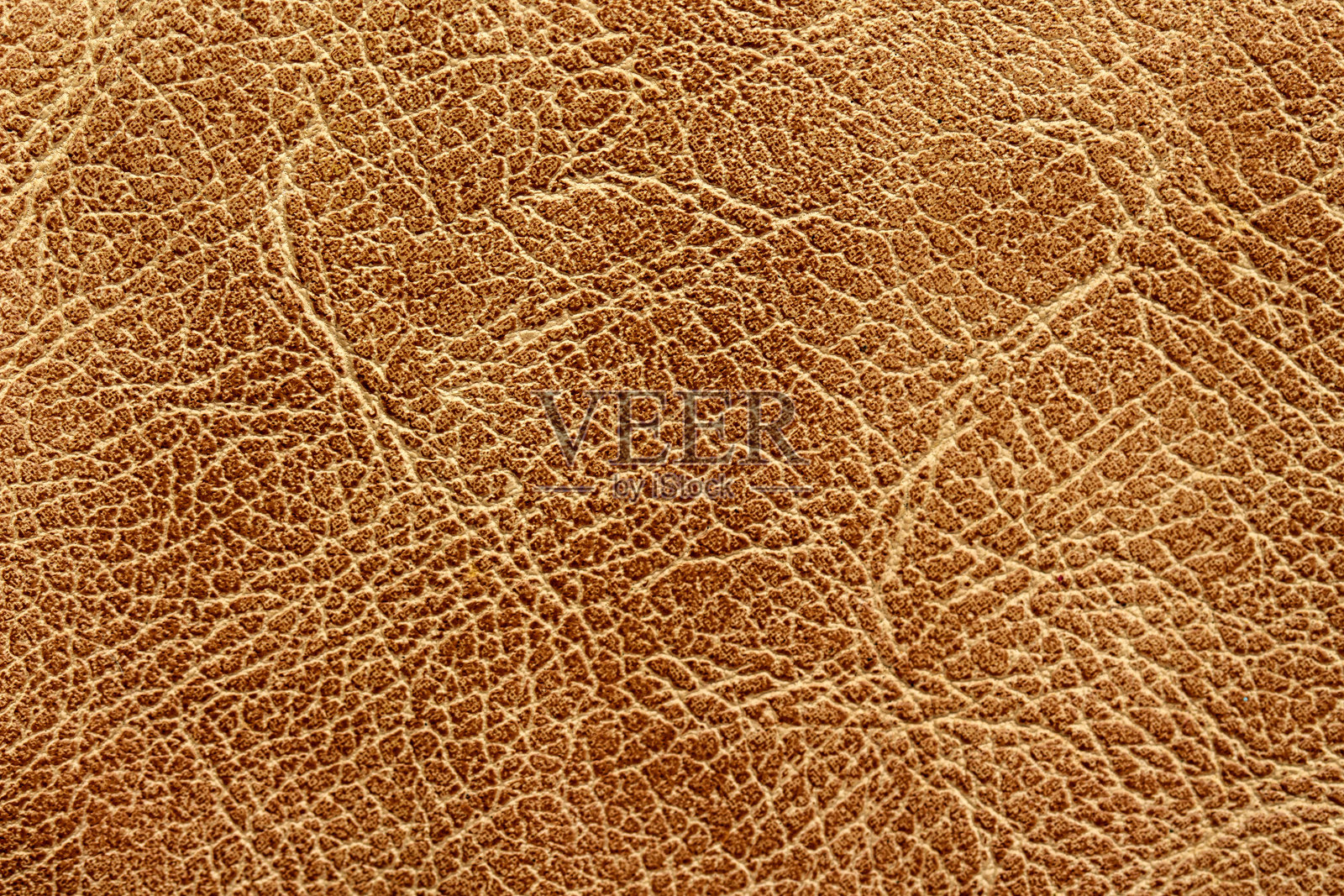 棕色合成皮革背景纹理特写。照片摄影图片