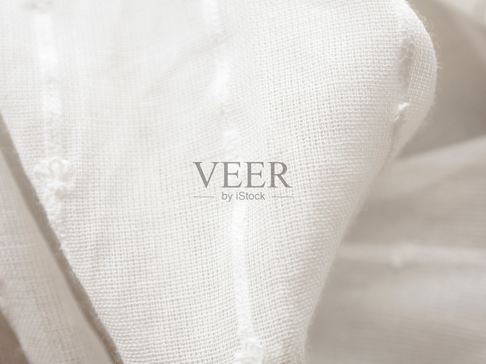 轻薄透明的面料特写,阳光透过,营造出轻盈和通透的感觉照片摄影图片