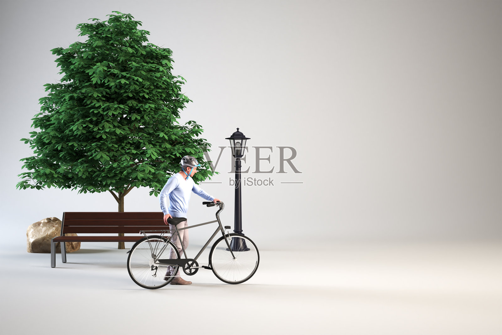 一名骑自行车的男子站在树下的公园长椅旁。照片摄影图片