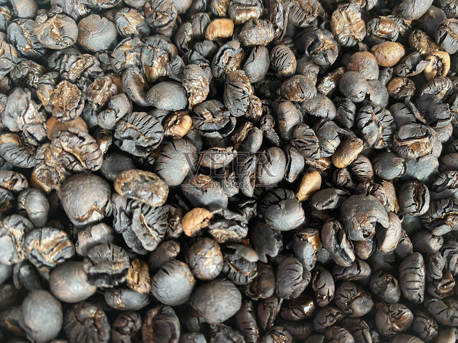 咖啡豆背景。烘焙咖啡豆的特写。照片摄影图片