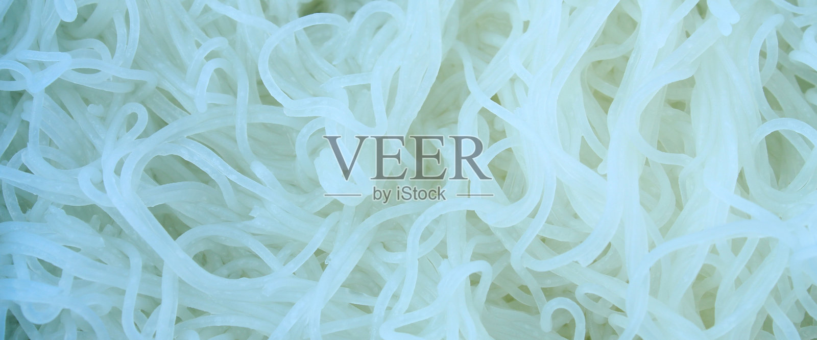 白色湿米粉的纹理和背景。白色米粉的特写。照片摄影图片