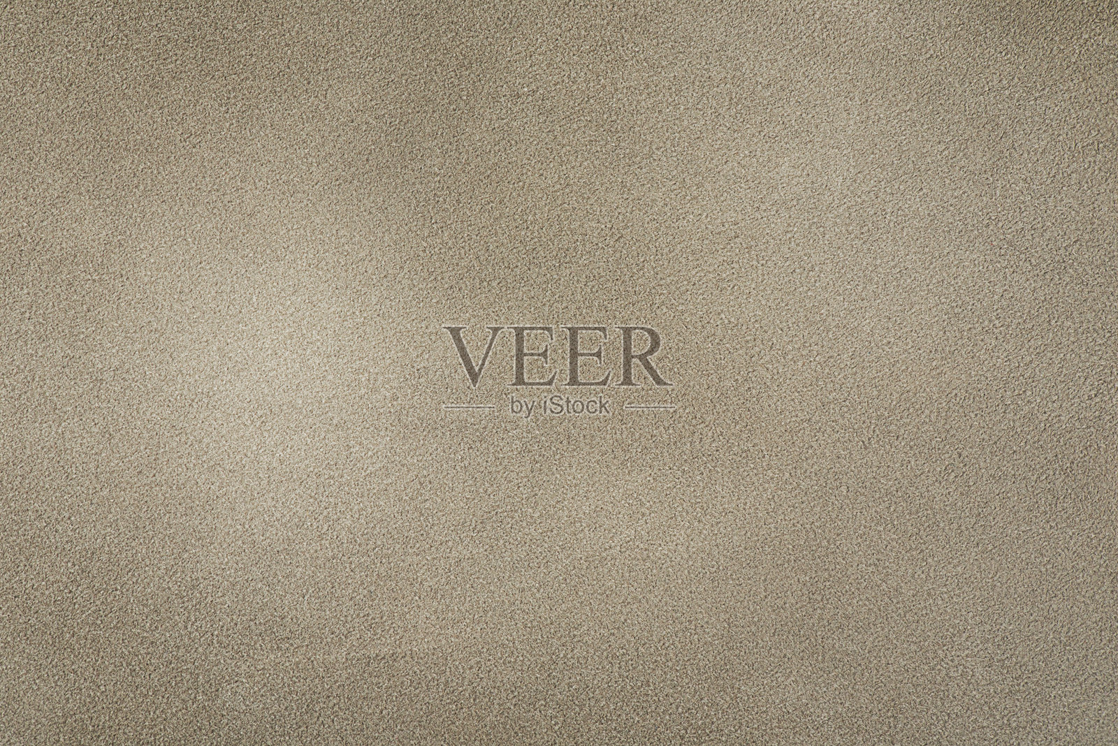 米色绒面革作为背景。绒面皮革特写照片,米色光影。照片摄影图片