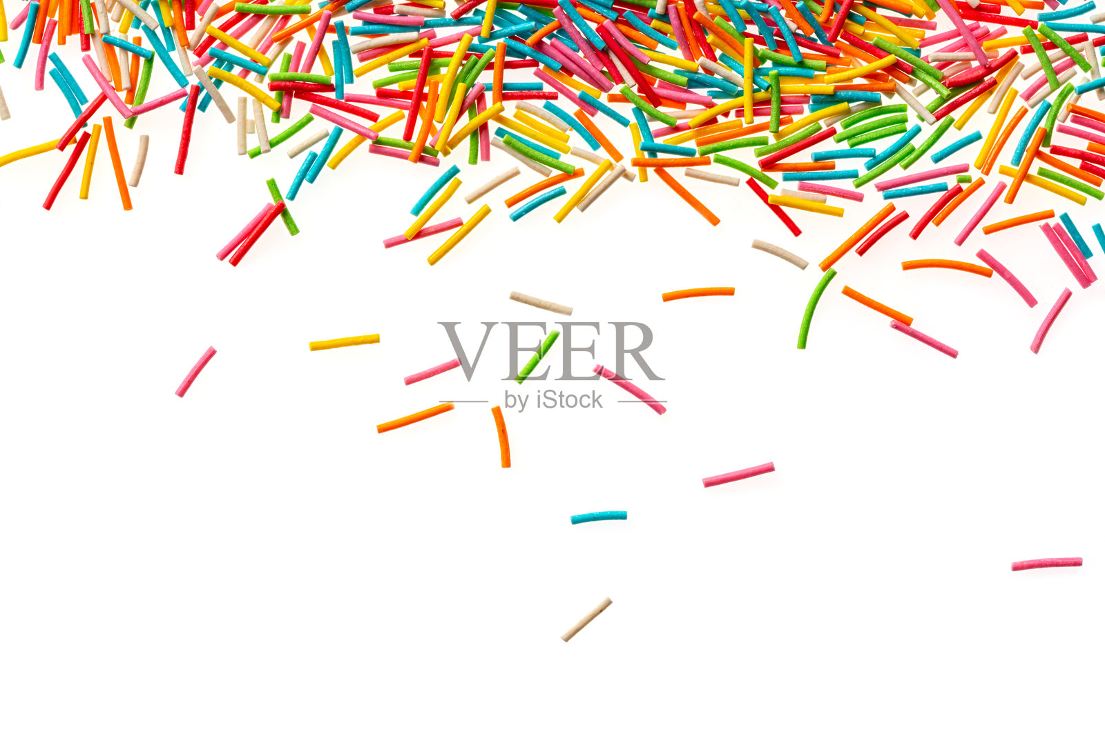 洒落的背景。五彩缤纷的洒水器。蛋糕、甜甜圈、烘焙装饰。糖果装饰背景,独立于白色背景。照片摄影图片