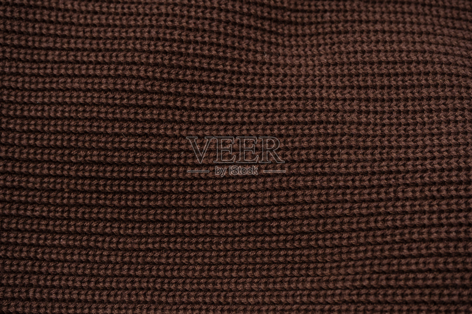 棕色毛衣纹理作为背景。照片摄影图片