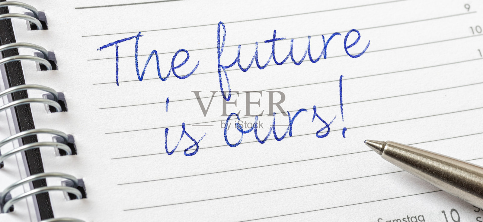 未来属于我们,写在日历页上照片摄影图片