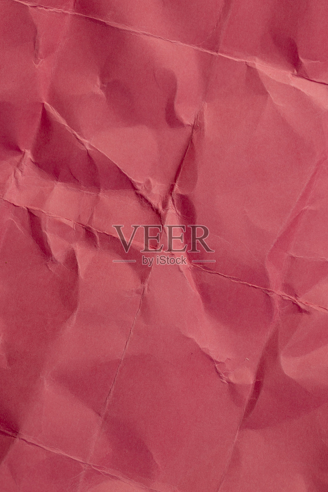 皱褶严重的红色纸张作为背景照片摄影图片