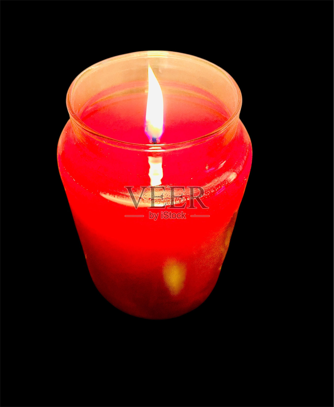 玻璃罐中的点燃红色蜡烛照片摄影图片
