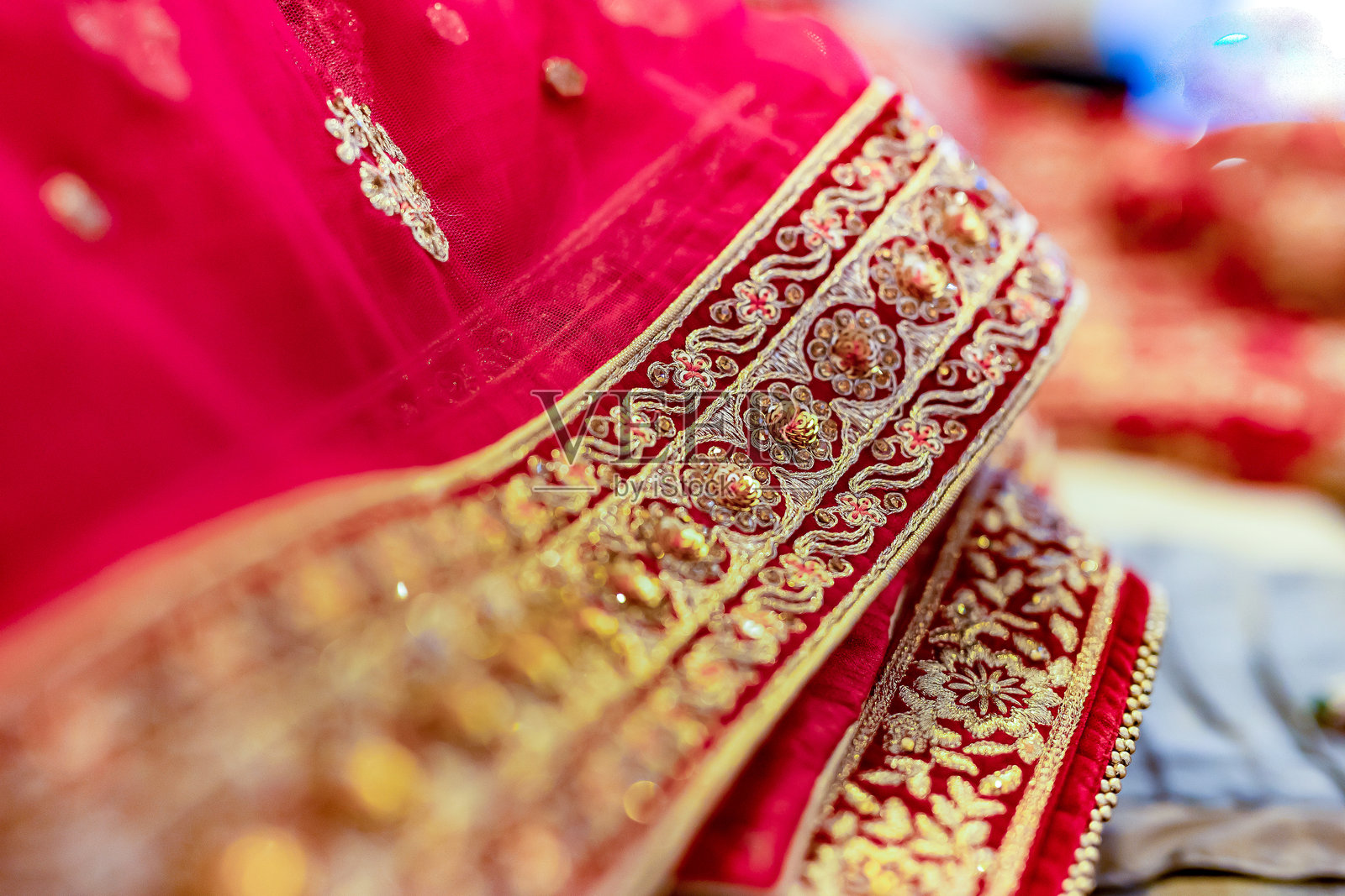 印度新娘婚礼服装的面料、纺织品和图案特写照片摄影图片