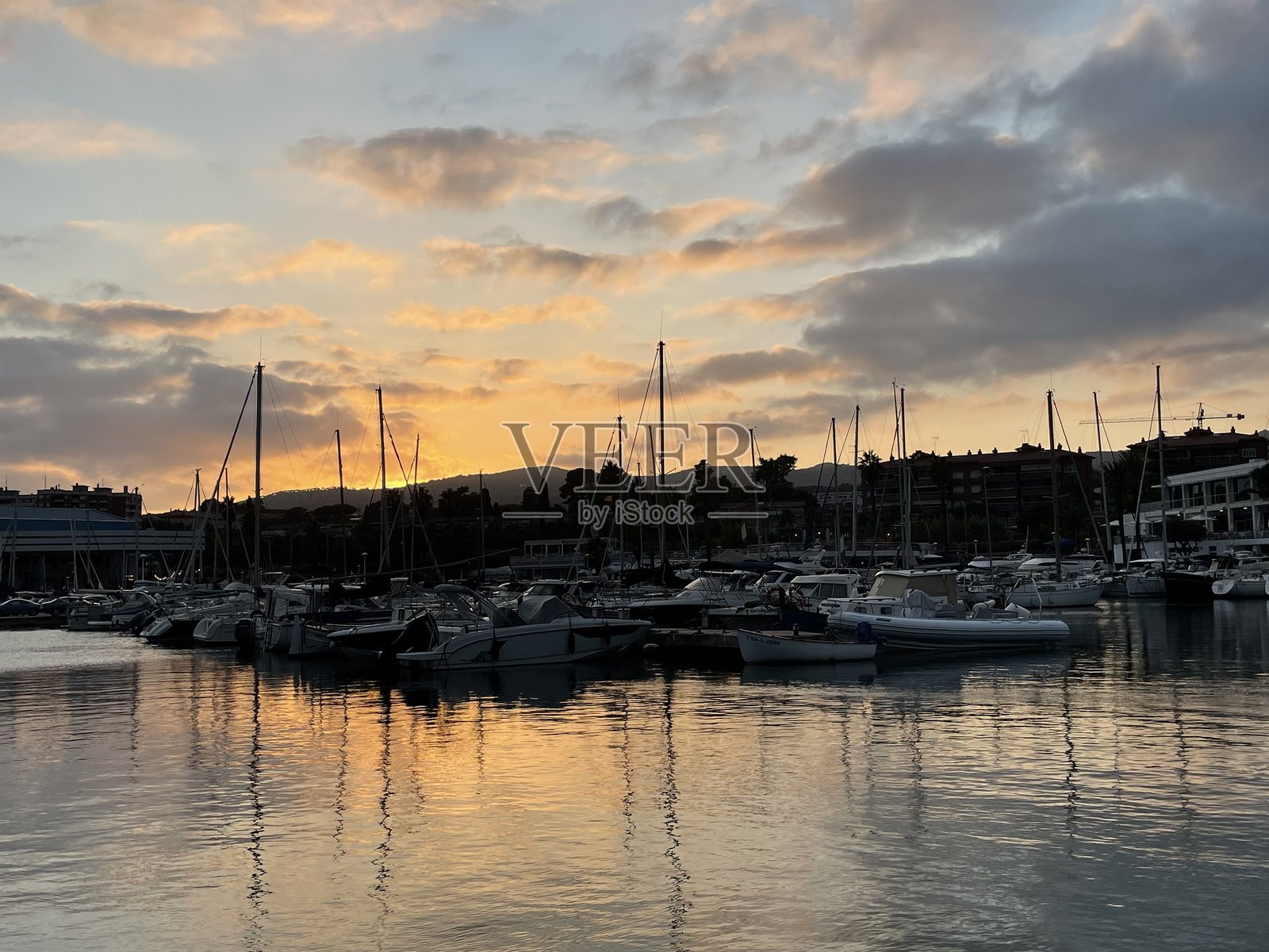 西班牙港口的日落照片摄影图片