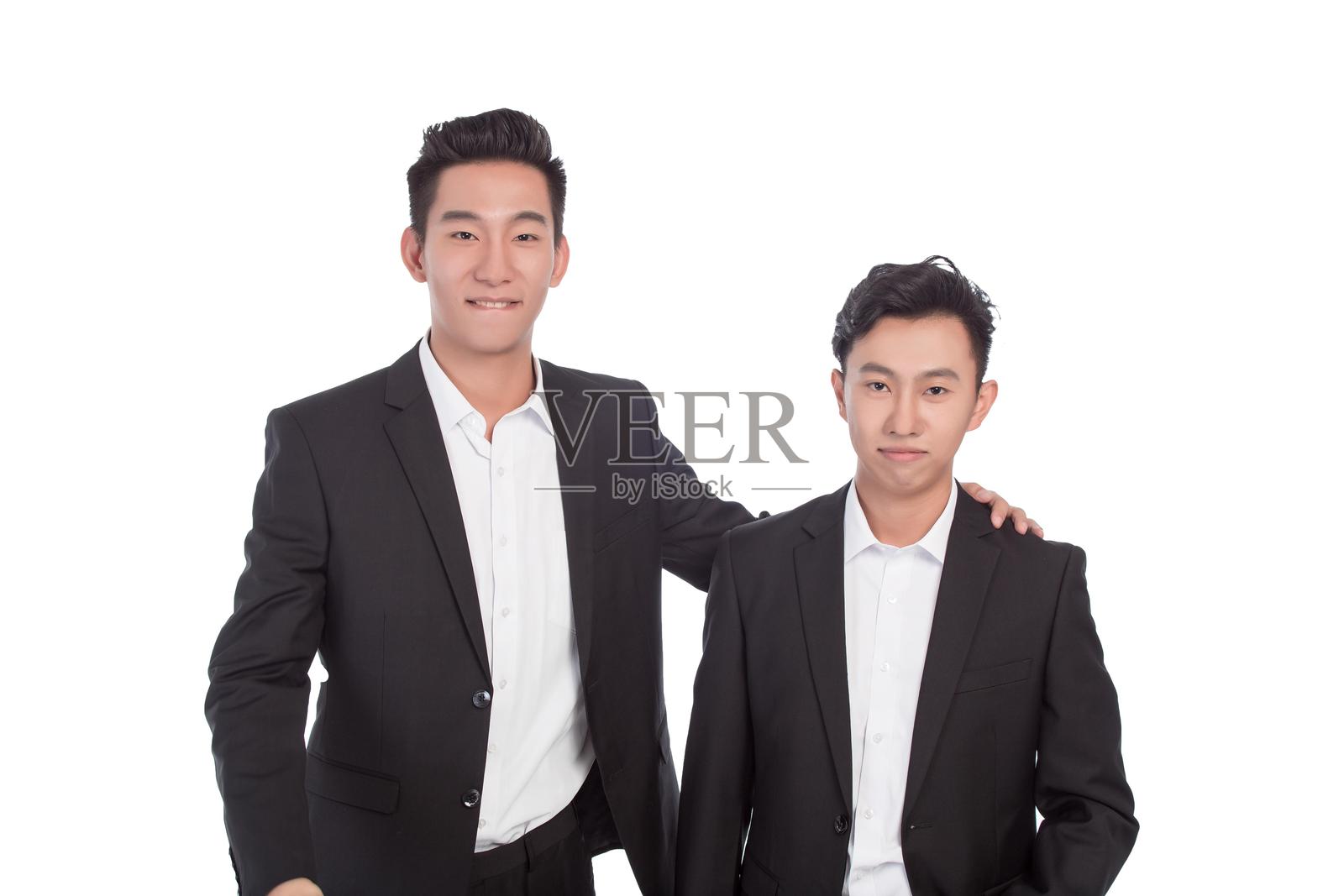 两位亚洲商人并肩而立照片摄影图片