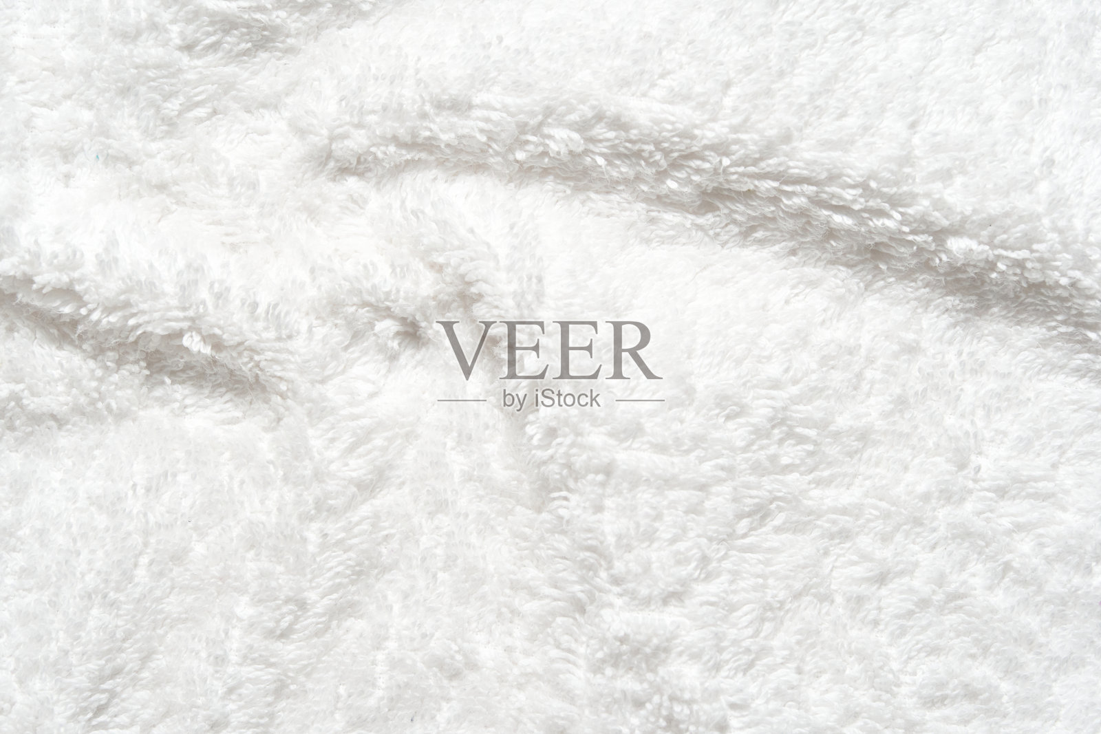 柔软的白色羊毛质地,表面蓬松,舒适宜人照片摄影图片