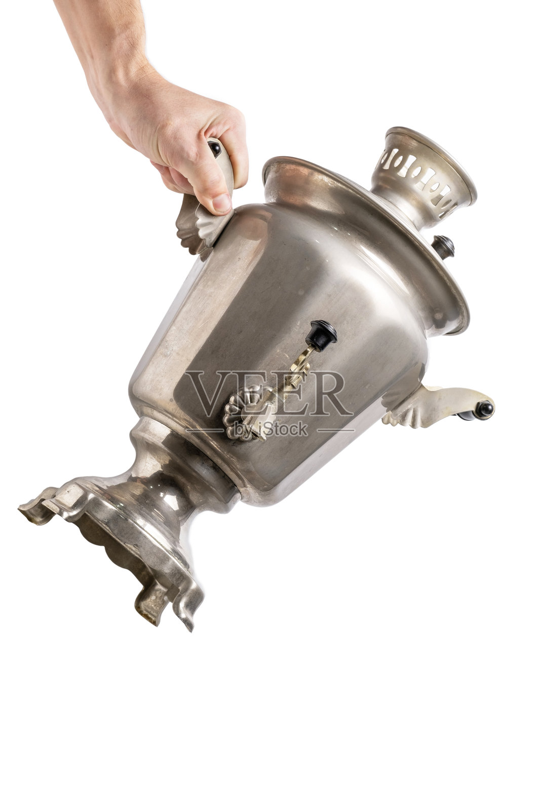 手持复古茶炊,背景为白色。照片摄影图片