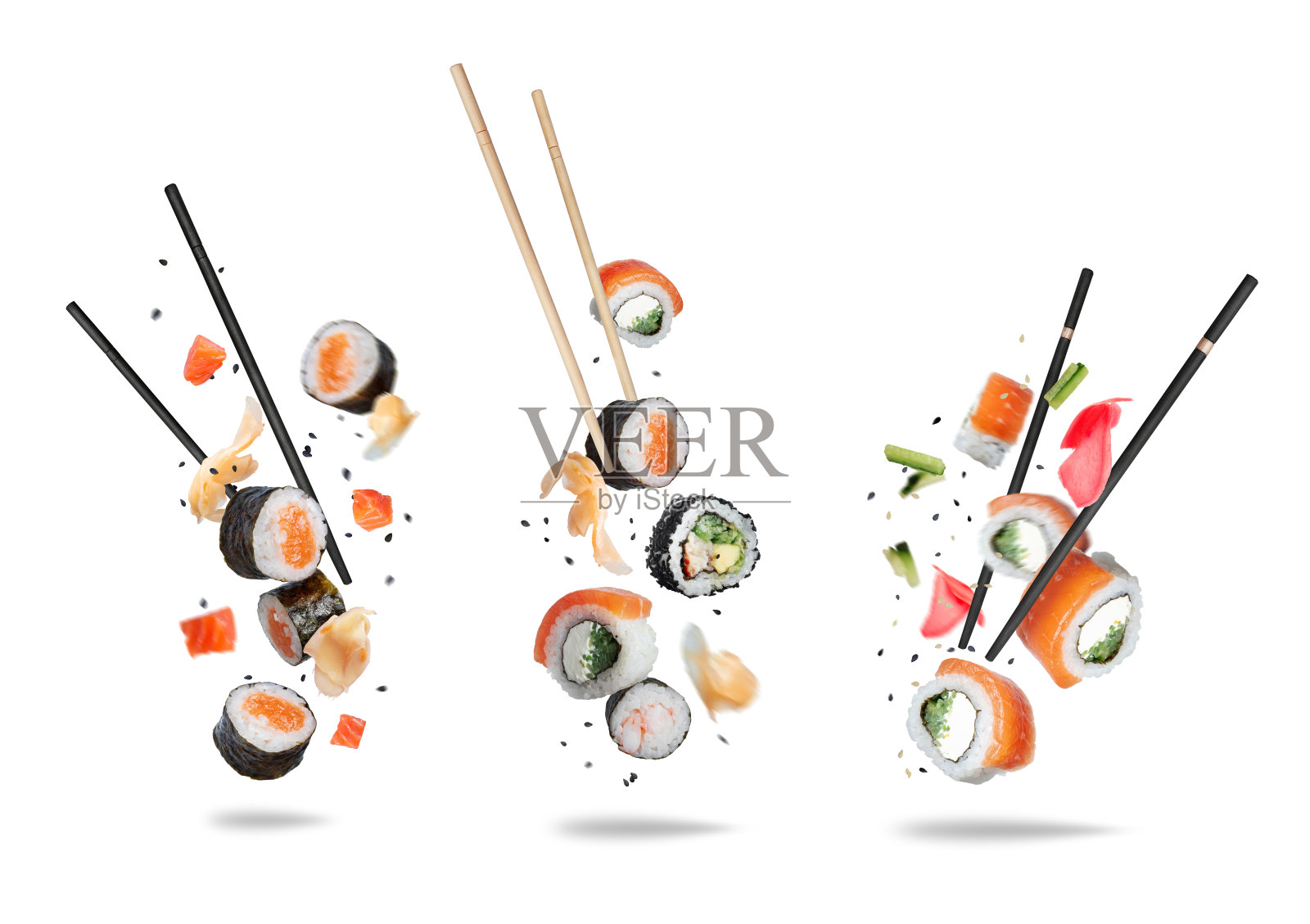 一组各种漂浮的寿司卷,配有木筷,背景为白色。照片摄影图片