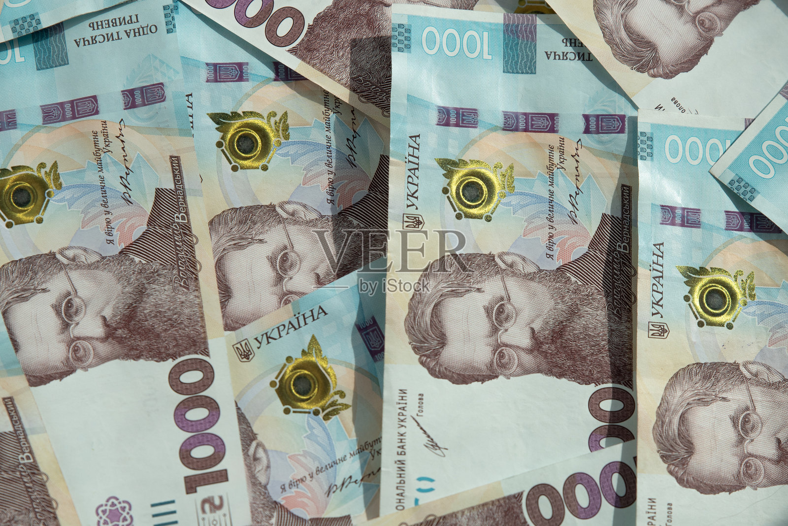 乌克兰货币。乌克兰纸币的纹理。乌克兰格里夫纳钞票。UAH钞票。1000格里夫纳。商业、金融、新闻背景。3D插图。照片摄影图片