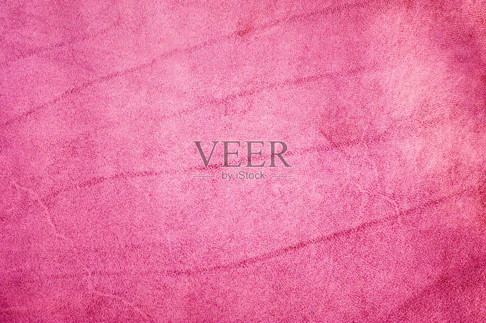 粉色绒面质感背景特写照片。照片摄影图片