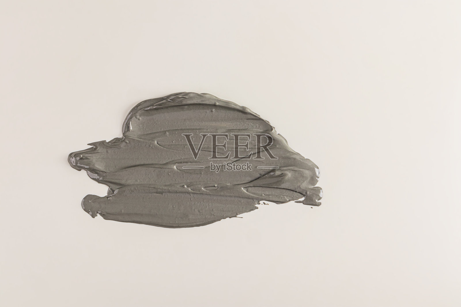 美丽的灰色化妆品质感笔触。天然有机粘土用于面部和身体护肤。化妆品质感图案。照片摄影图片