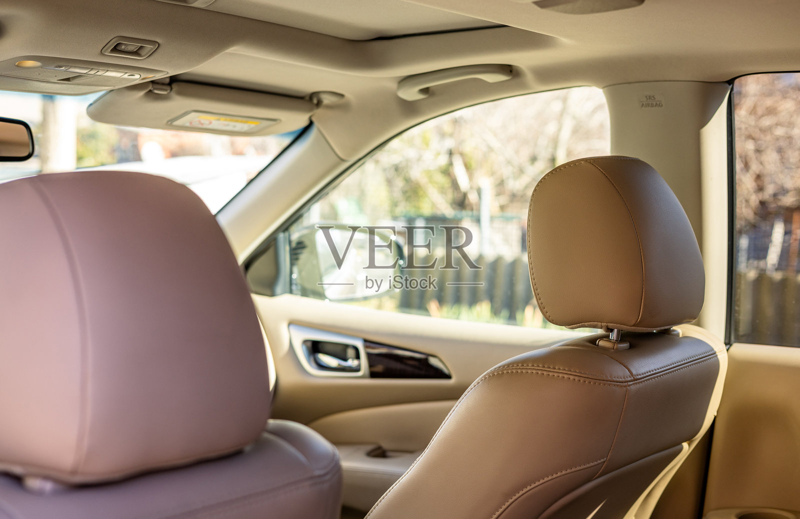 Part of leather car headrest seat details. Car inside. Interior of prestige modern car. Comfortable leather seats照片摄影图片