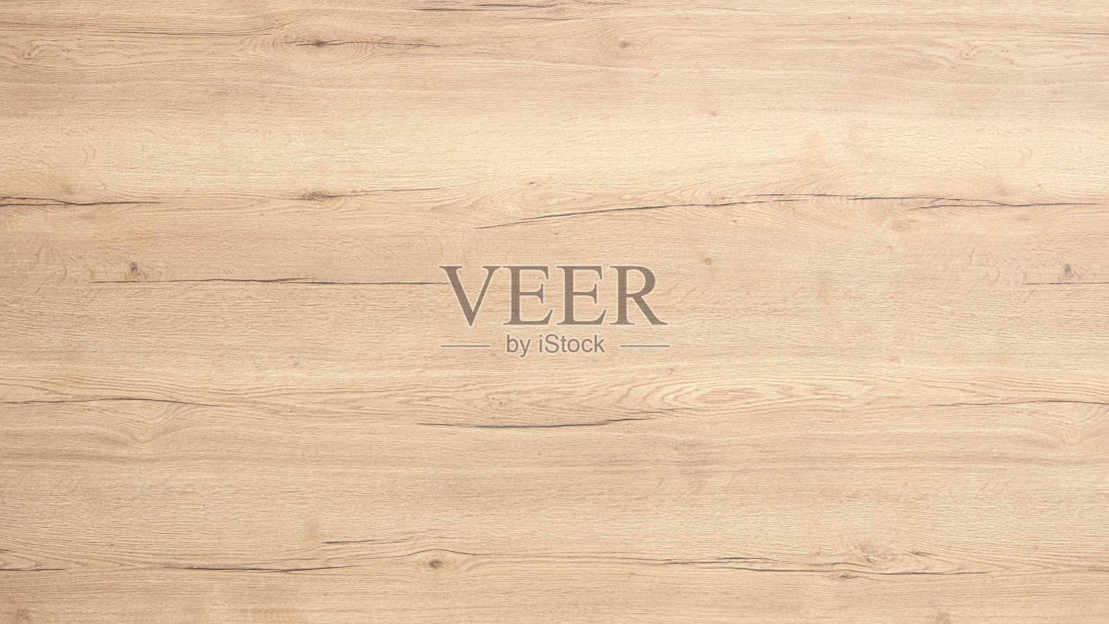 一块具有颗粒纹理的木质表面。木材呈棕色,外观自然。表面光滑,给人一种温暖、宜人的感觉。照片摄影图片