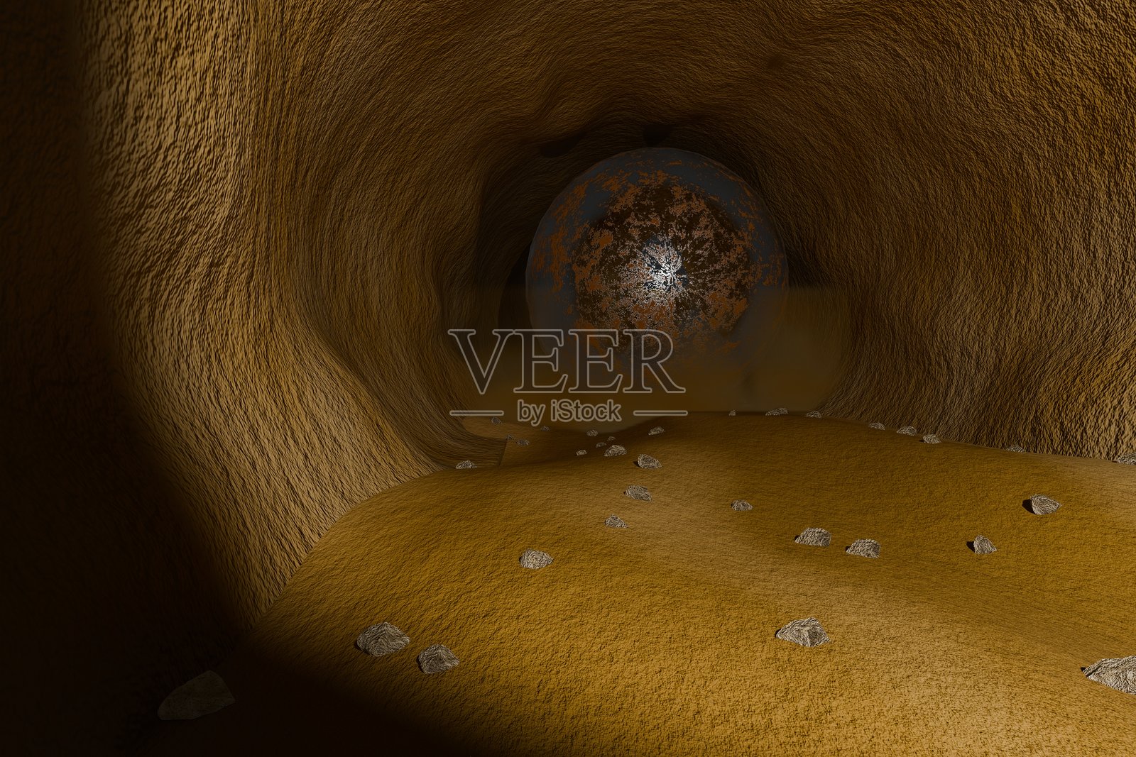 一个大铁球从洞穴深处滚下来照片摄影图片