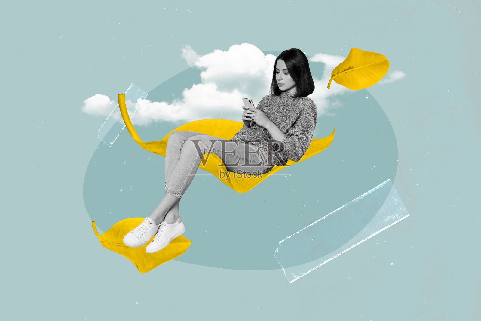 创意艺术海报拼贴,女孩坐在黄色干叶子上,使用手机设备,背景为蓝色。照片摄影图片