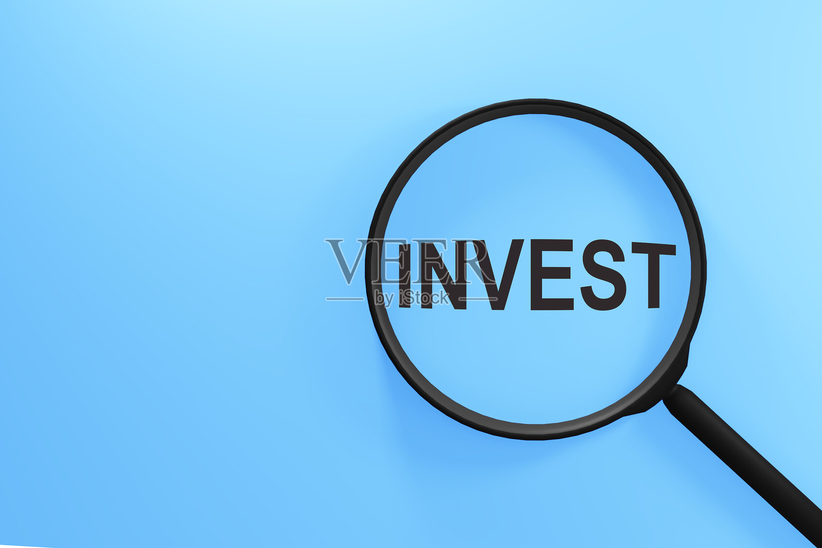 放大镜特写,下面写着“投资”一词。照片摄影图片