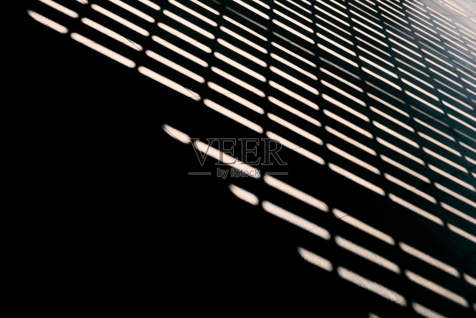 水泥墙面建筑背景上的光影照片摄影图片