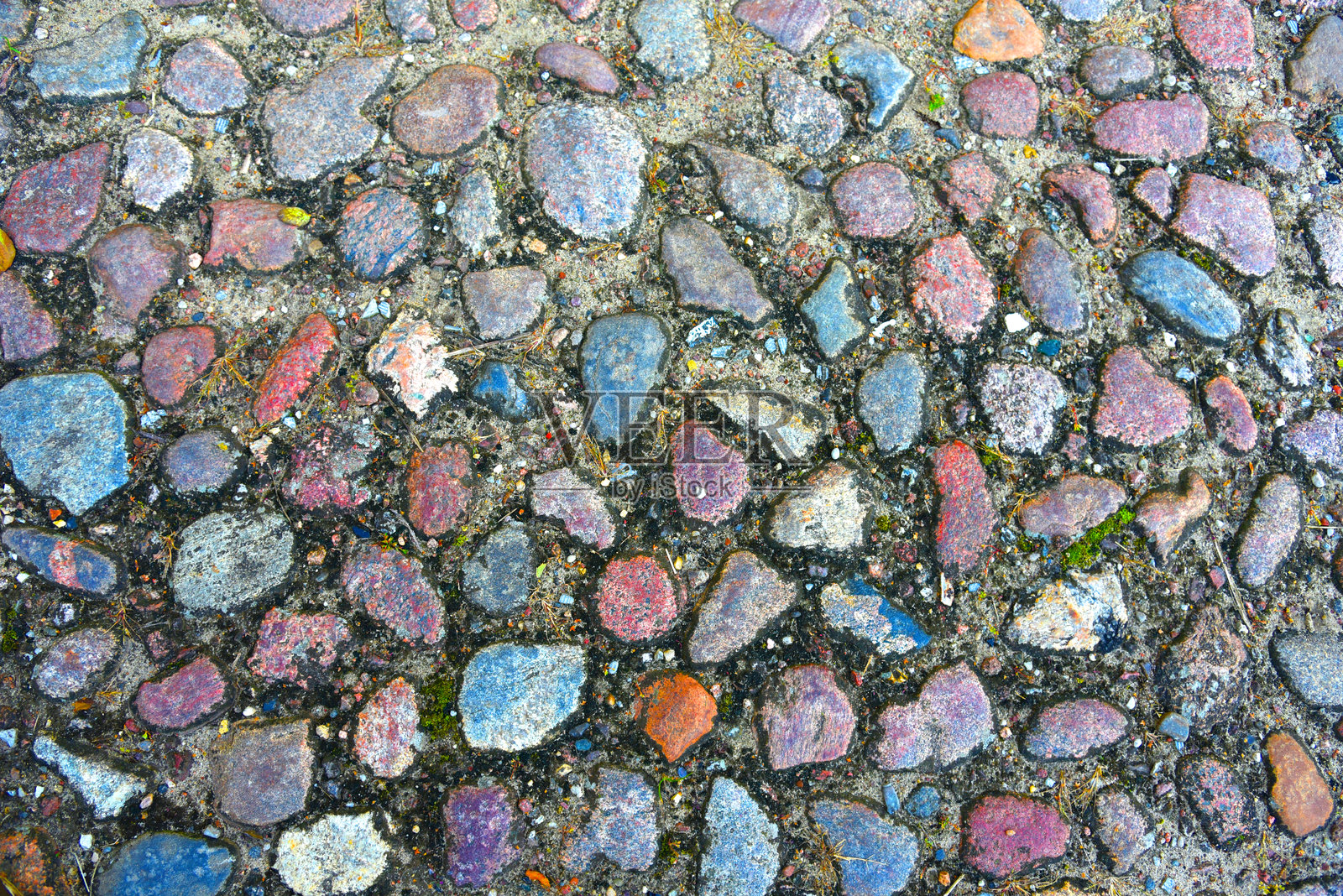 石墙。旧石墙与混凝土的背景。照片摄影图片