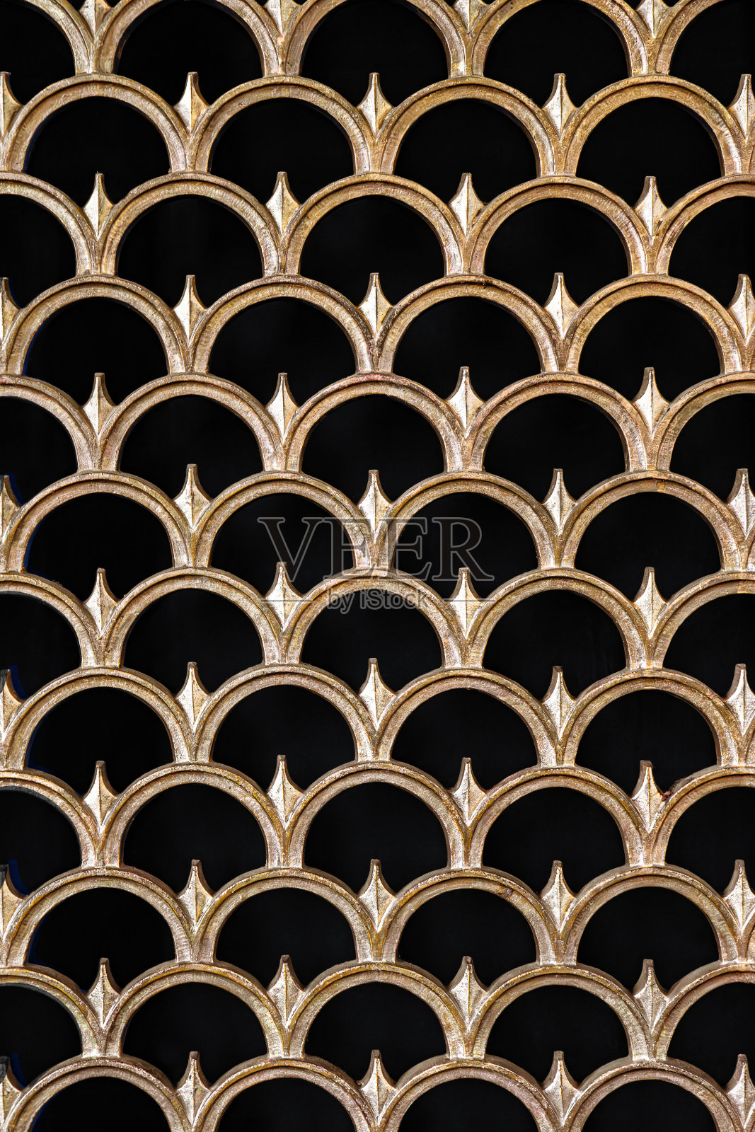 黑色和金色华丽的扇贝鱼鳞装饰艺术风格图案摄影抽象背景照片摄影图片