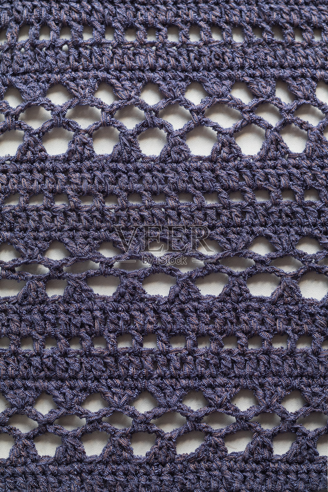 蓝色无缝针织纹理。钩编网格图案。针织背景。照片摄影图片