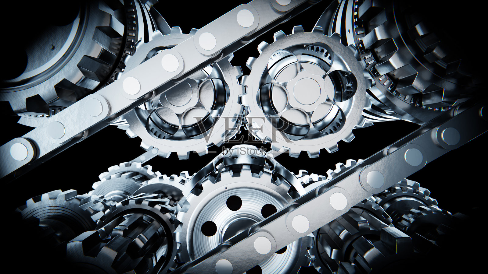 黑色背景上旋转的金属齿轮和链条照片摄影图片