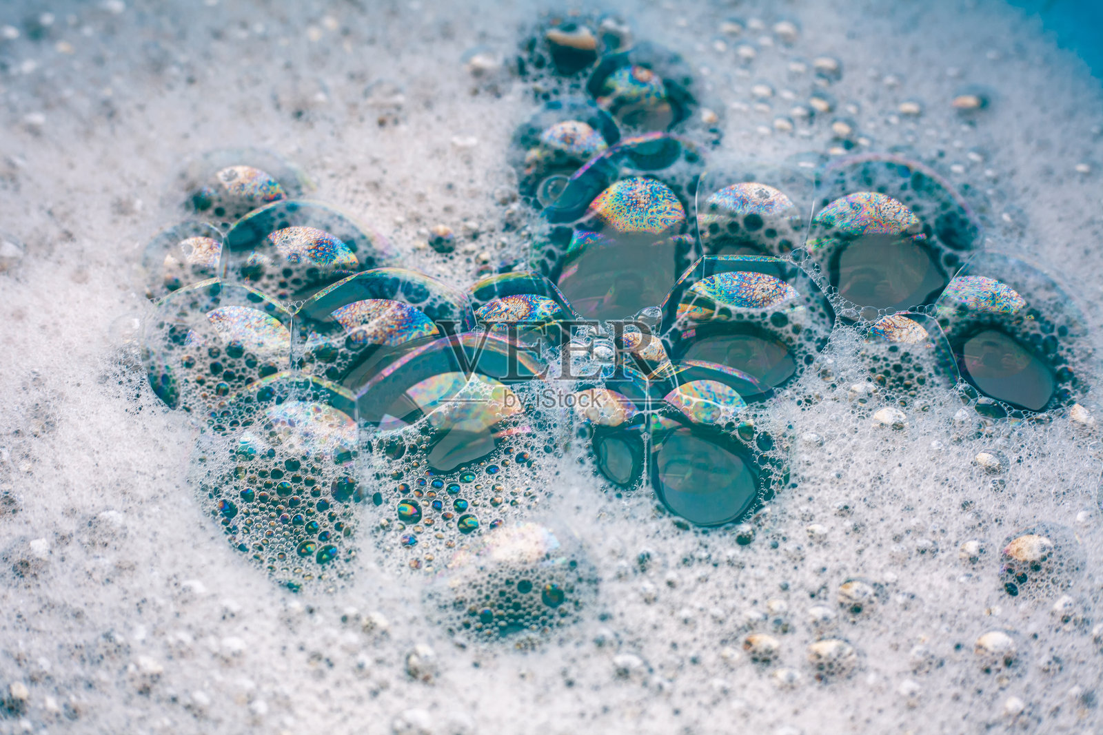 白色肥皂泡沫。肥皂泡的特写纹理。泡泡浴。洗衣凝胶。洗涤用肥皂。照片摄影图片