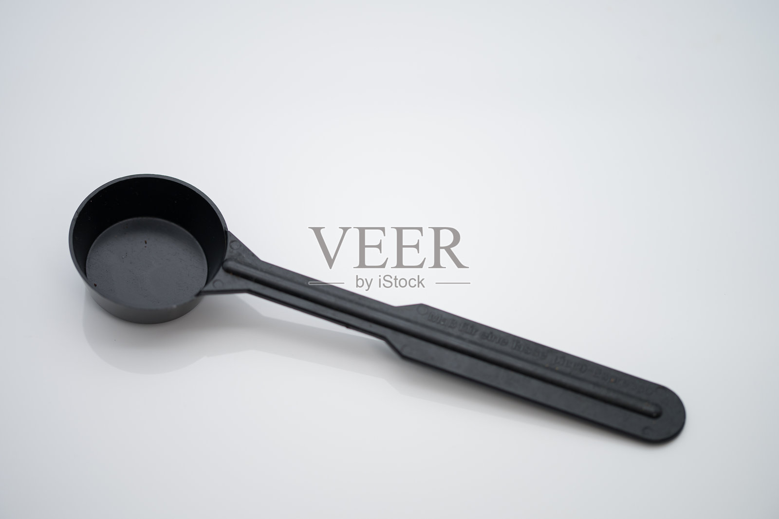 黑色塑料咖啡量勺照片摄影图片