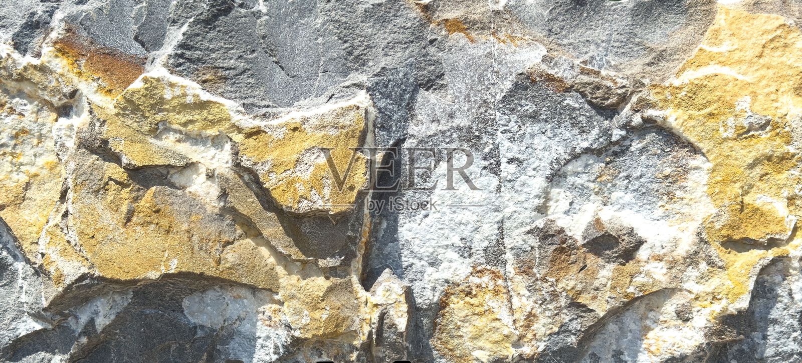 坚硬的石头表面,带有矿物层次照片摄影图片