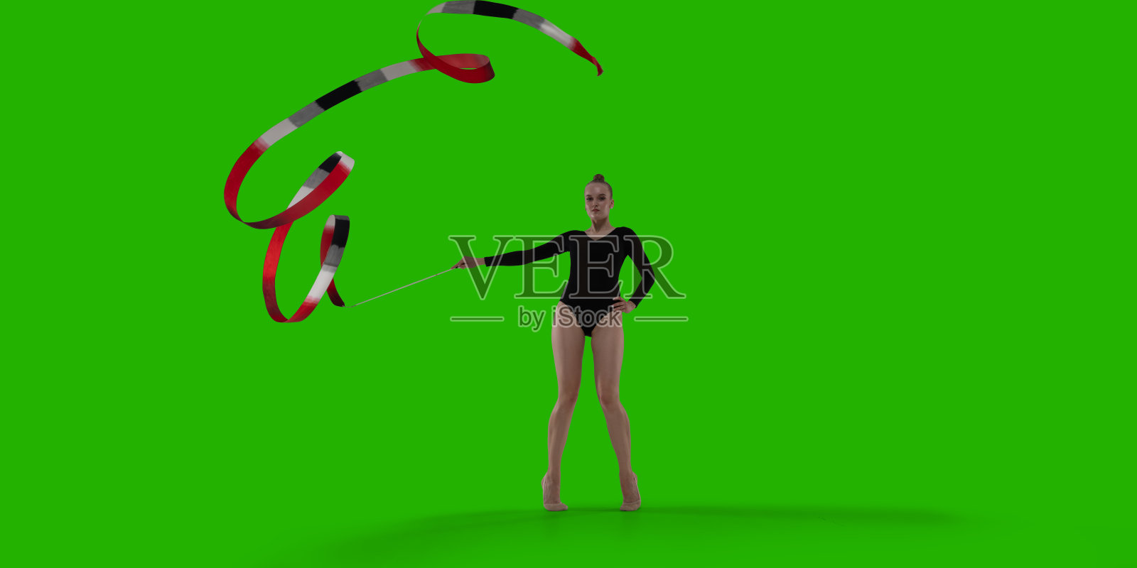 绿幕背景上的韵律体操女运动员。照片摄影图片