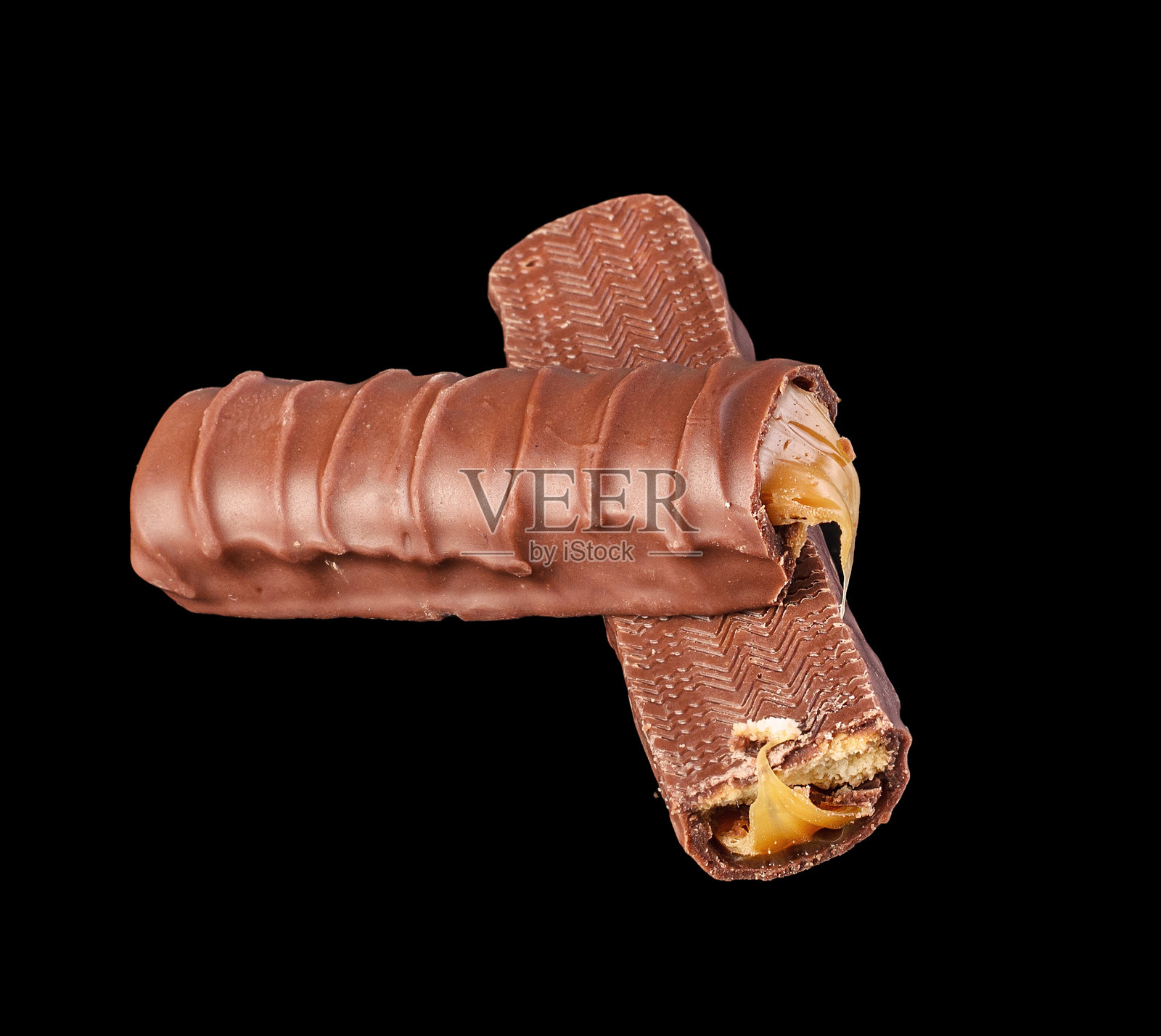黑色背景上的巧克力棒,抽象食品概念照片摄影图片