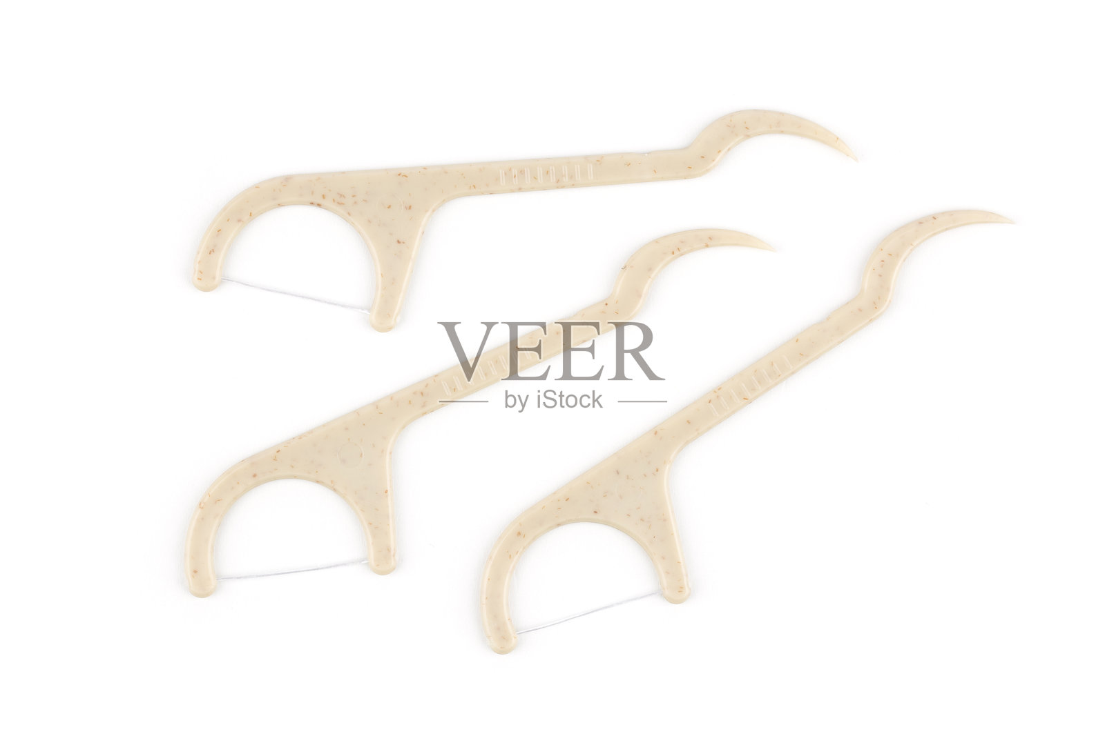 环保玉米淀粉牙签,带牙线,背景为白色照片摄影图片